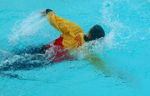 SWIM STROKES, FRONT CRAWL, 4
Water in sleeves is heavy but clothes make a useful towing aid 4